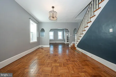 a view of kitchen with granite countertop window and stainless steel appliances