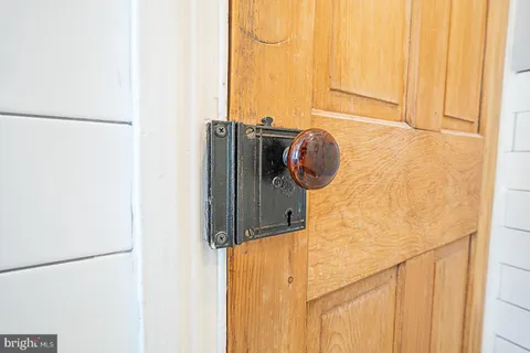 a kitchen with a sink a stove and cabinets