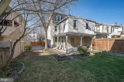 a view of house with outdoor space and sitting area