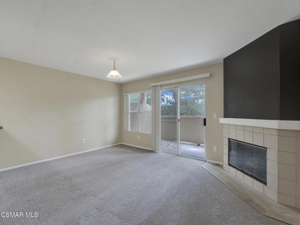 2731 Erringer Road, Unit 28 Simi Valley, CA 93065 - Photo 14 of 30 a view of empty room with a fireplace