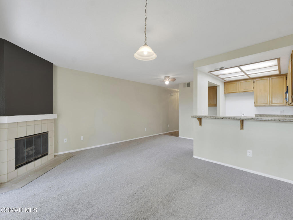 2731 Erringer Road, Unit 28 Simi Valley, CA 93065 - Photo 15 of 30 a view of an empty room with a fireplace and a window