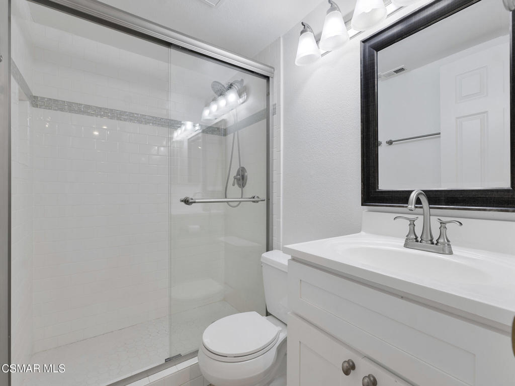 2731 Erringer Road, Unit 28 Simi Valley, CA 93065 - Photo 23 of 30 a bathroom with a sink a toilet and shower