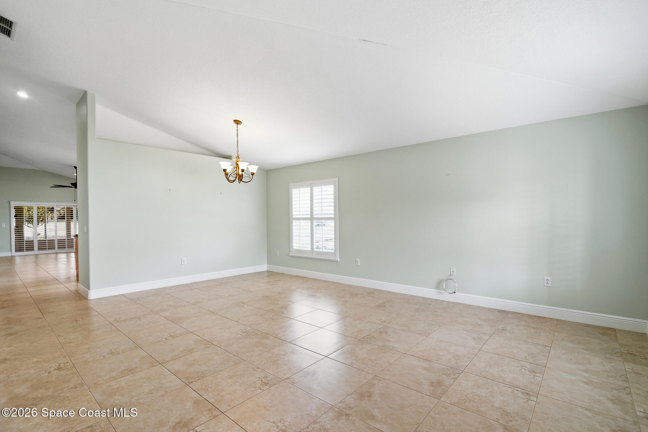 1785 Boca Rio Drive Melbourne, FL 32940 - Photo 10 of 66 Living & Dining AreaLiving & Dining Area