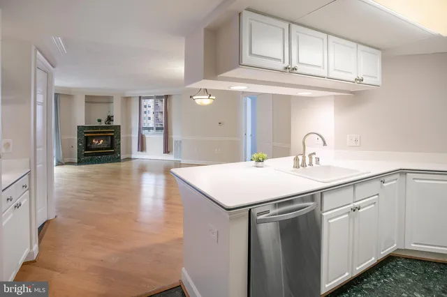 a kitchen with a sink and cabinets