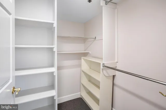 a view of an empty walk in closet