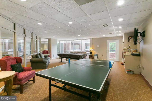 a view of a house with backyard and porch