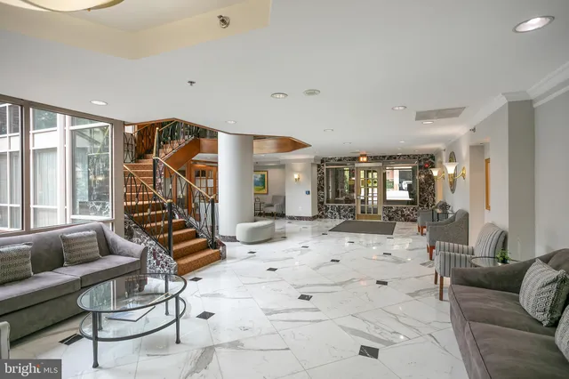 a view of a room with gym equipment and large window