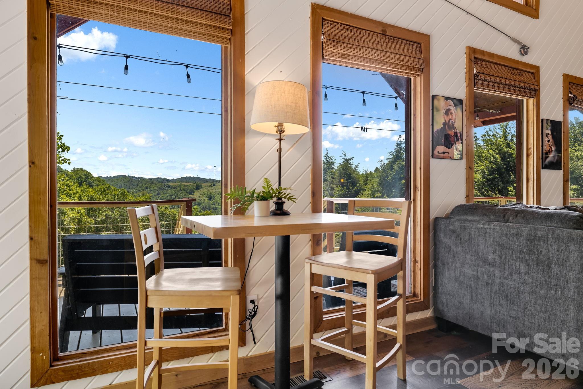 694 Boulder Road Marshall, NC 28753 - Photo 10 of 44 a view of a chairs and table in the balcony