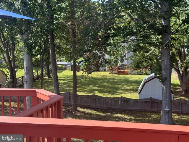 a view of a dining room with furniture and window