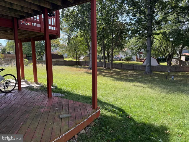 a kitchen with stainless steel appliances granite countertop a refrigerator stove microwave and sink