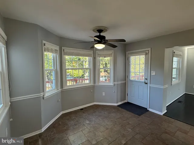 a view of a backyard with sitting area