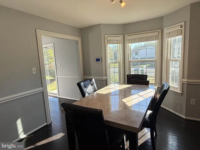 a white toilet sitting next to a window