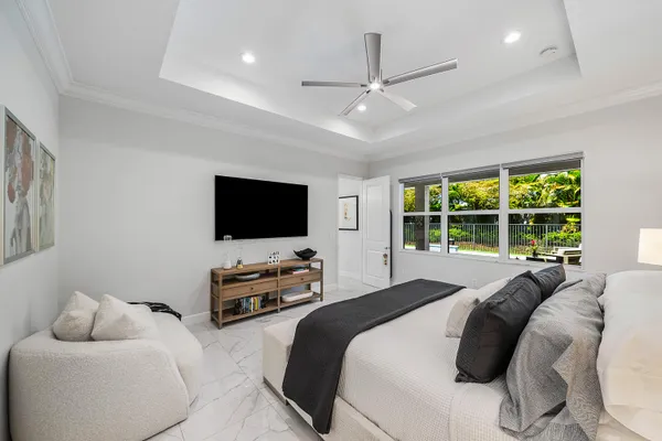 a bedroom with a bed and a couch