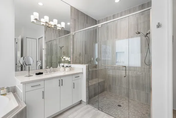 a bathroom with a granite countertop sink a toilet and a mirror
