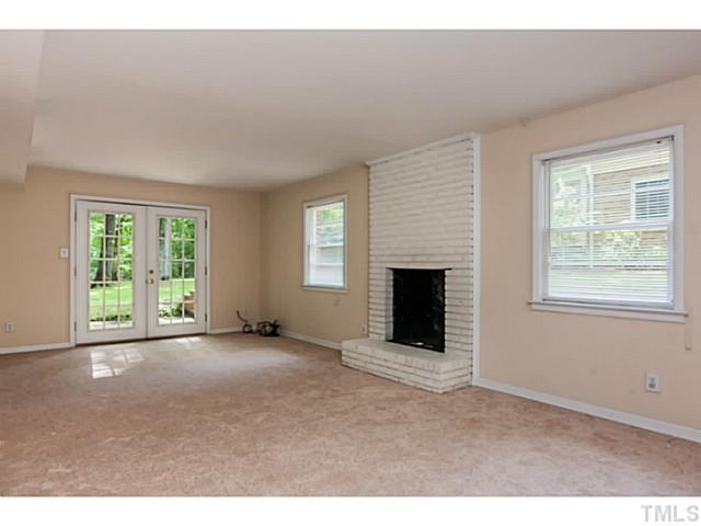 1731 Euclid Road Durham, NC 27713 - Photo 6 of 25 a view of an empty room with window and fire place