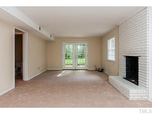 1731 Euclid Road Durham, NC 27713 - Photo 7 of 25 a view of a windows and an empty room with a fireplace