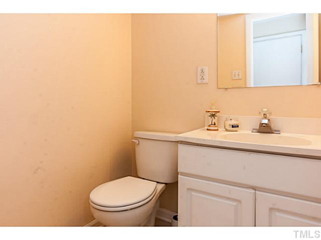 1731 Euclid Road Durham, NC 27713 - Photo 8 of 25 a bathroom with a sink a toilet and mirror