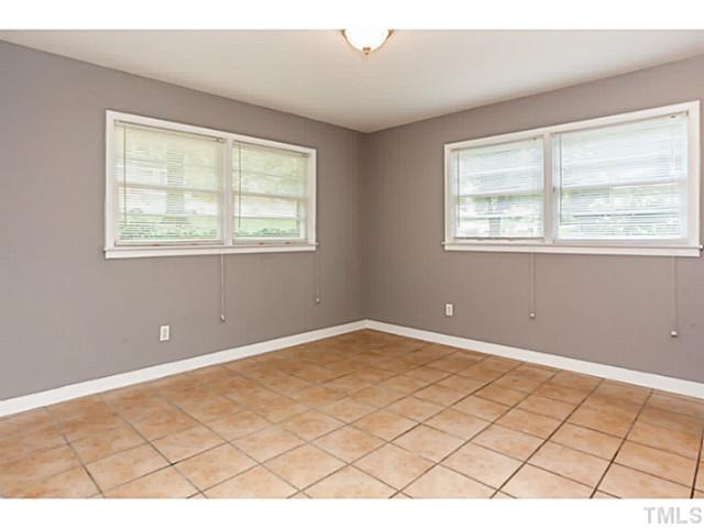 1731 Euclid Road Durham, NC 27713 - Photo 9 of 25 a view of an empty room with a window