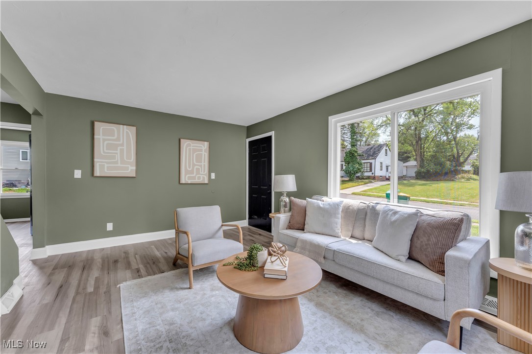20813 Hansen Road Maple Heights, OH 44137 - Photo 16 of 40 Living area with plenty of natural light and wood finished floors