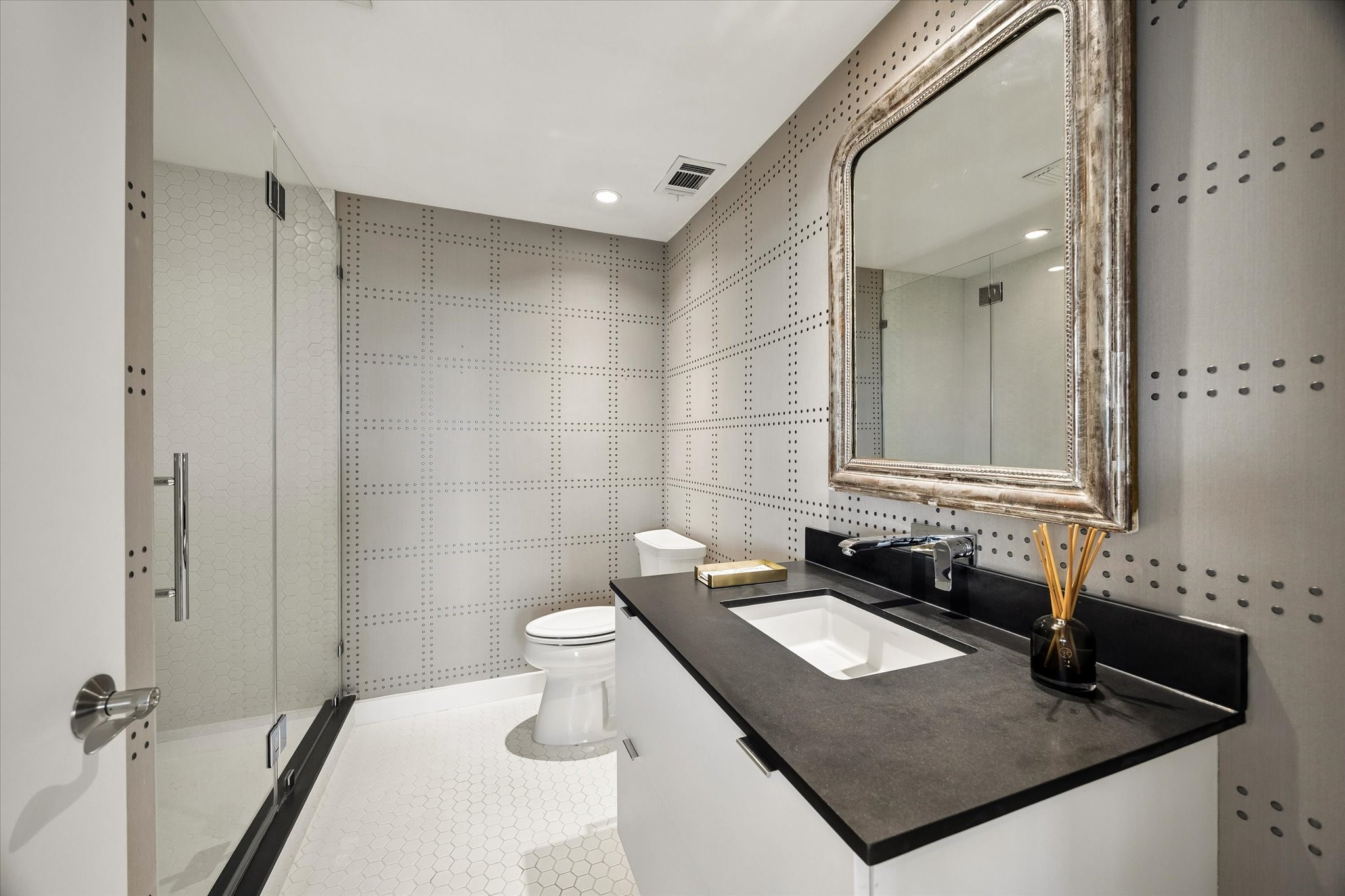 2200 Willowick Road, Unit 5C Houston, TX 77027 - Photo 13 of 27 Powder/full bath with floating vanity off living room. A great powder room and a full bath.