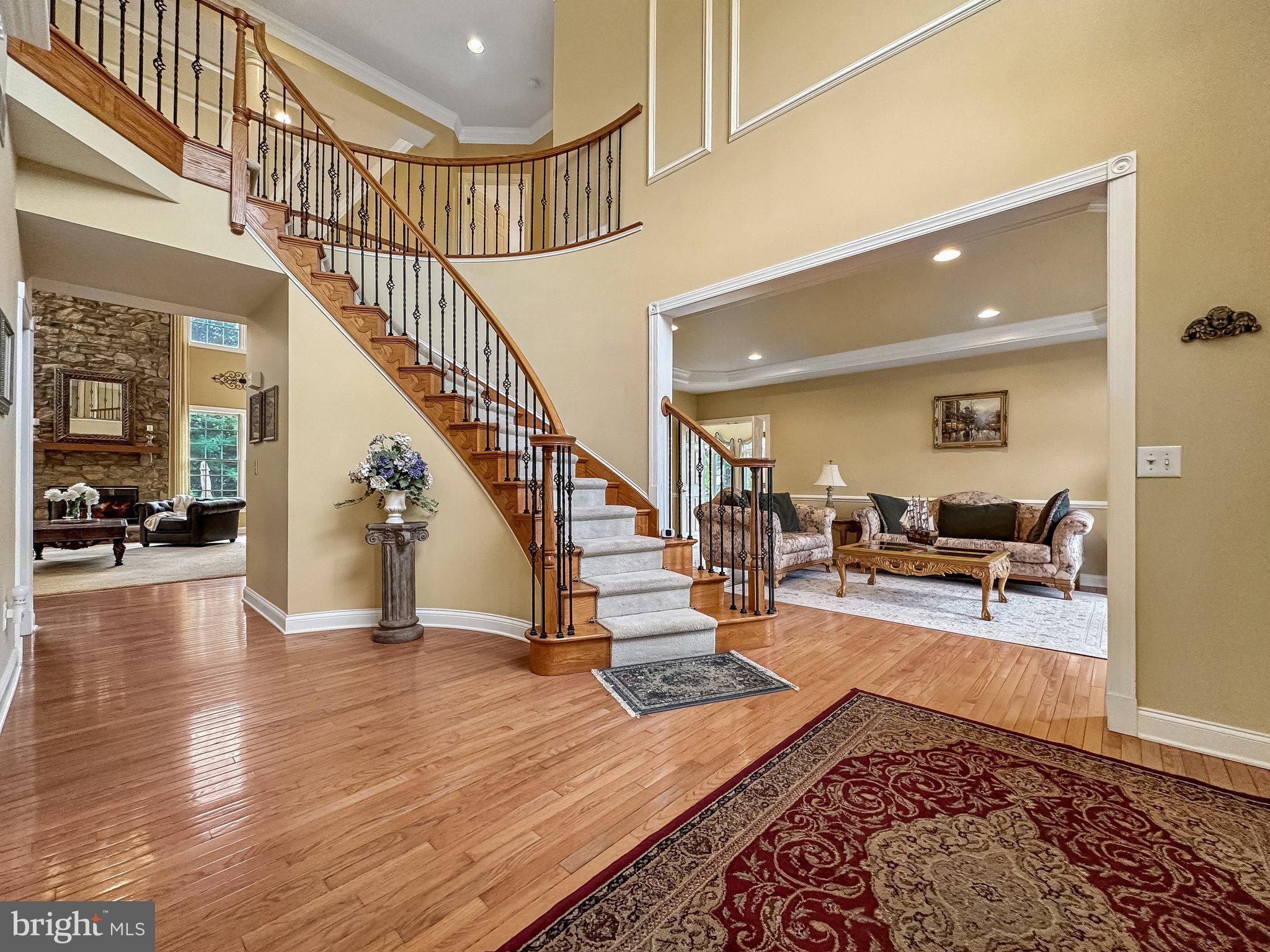 1 Baker Way Pennington, NJ 08534 - Photo 6 of 77 a view of entryway and hall with wooden floor