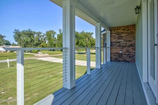 a view of balcony with wooden floor