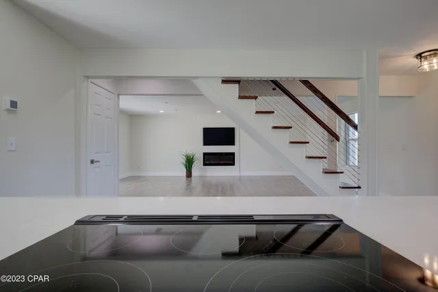 a living room with furniture and stairs