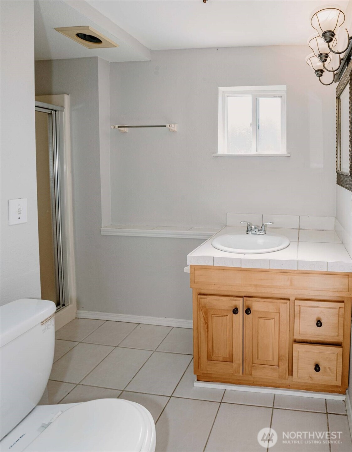 2220 Summit Avenue Everett, WA 98201 - Photo 14 of 26 a bathroom with a sink a toilet and shower