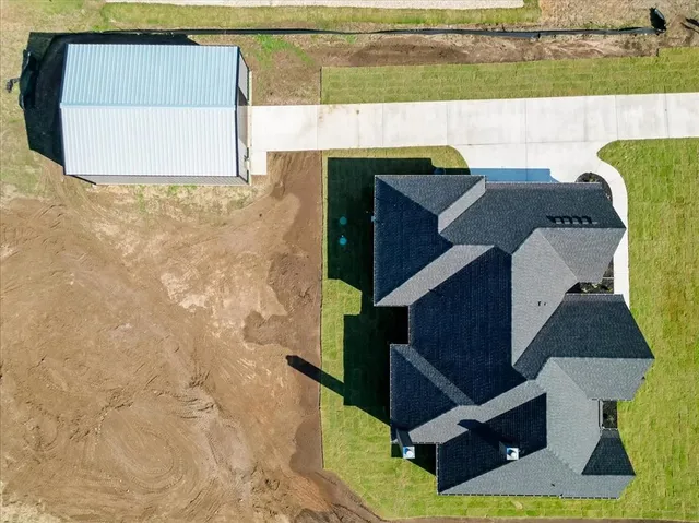 an empty room with a window and a ceiling fan