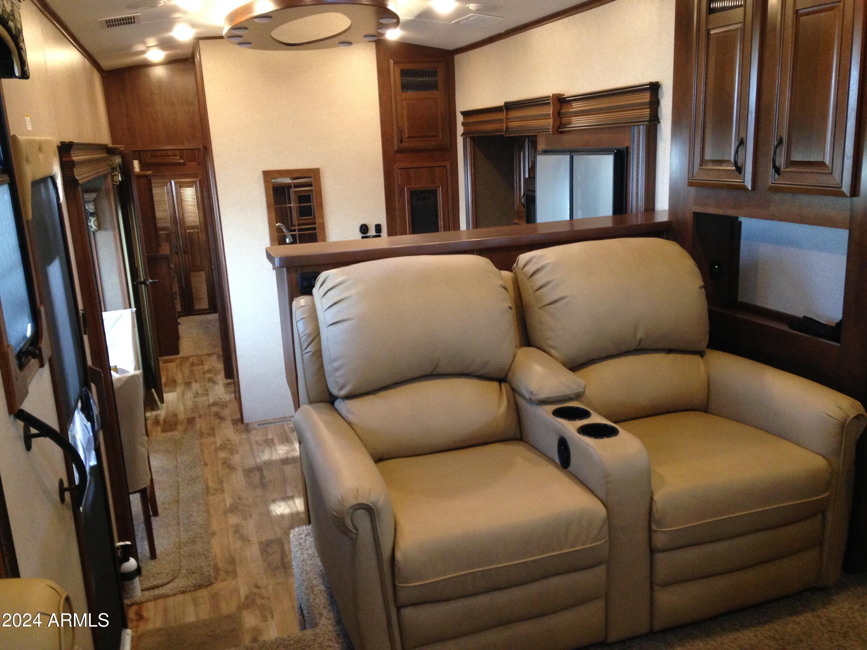 2 County Rd N2331 Nutrioso, AZ 85932 - Photo 17 of 40 a living room with furniture a fireplace and a flat screen tv