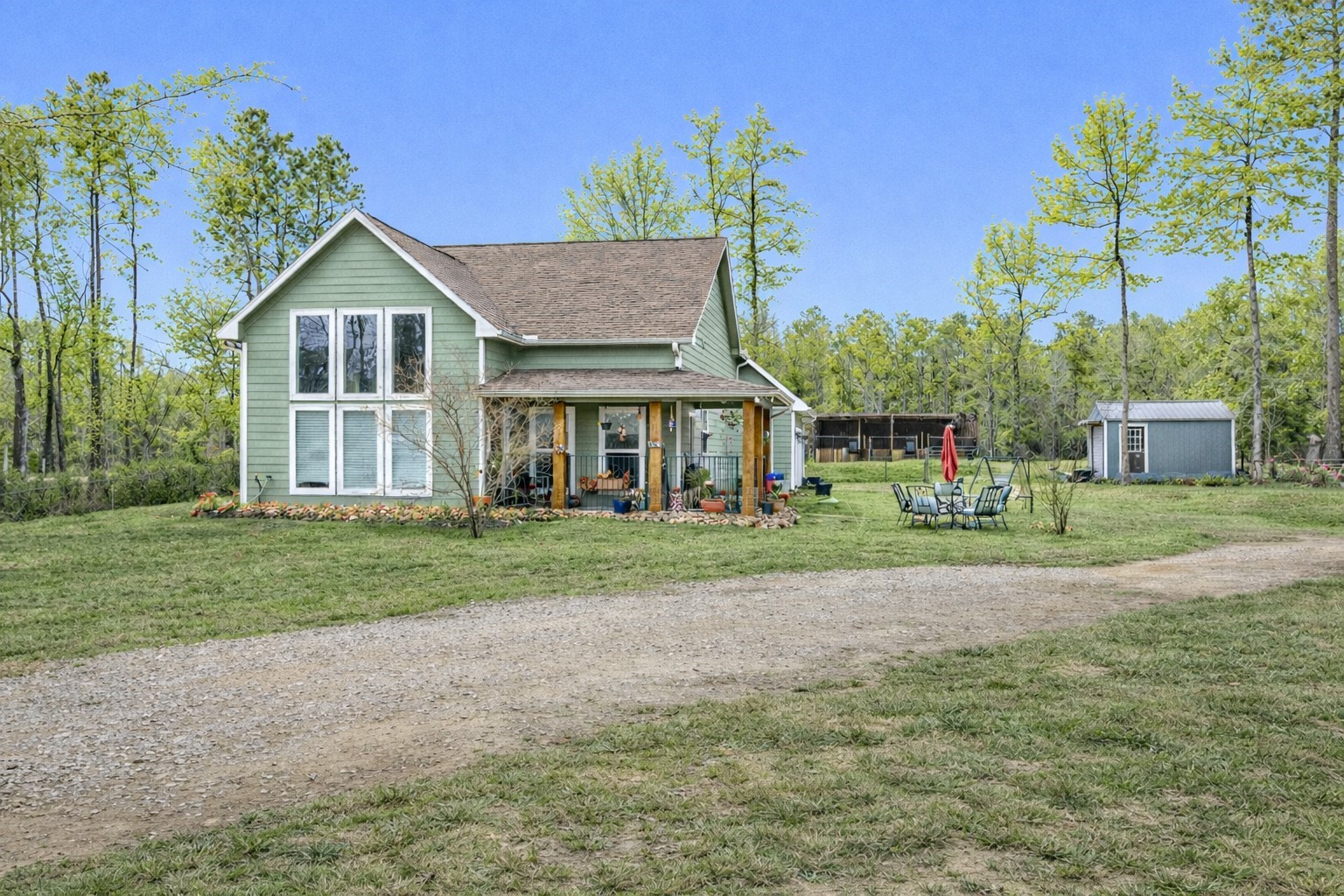 159 East Double Crk Road Willis, TX 77378 - Photo 3 of 40 Digitally edited to show spring-like landscaping.