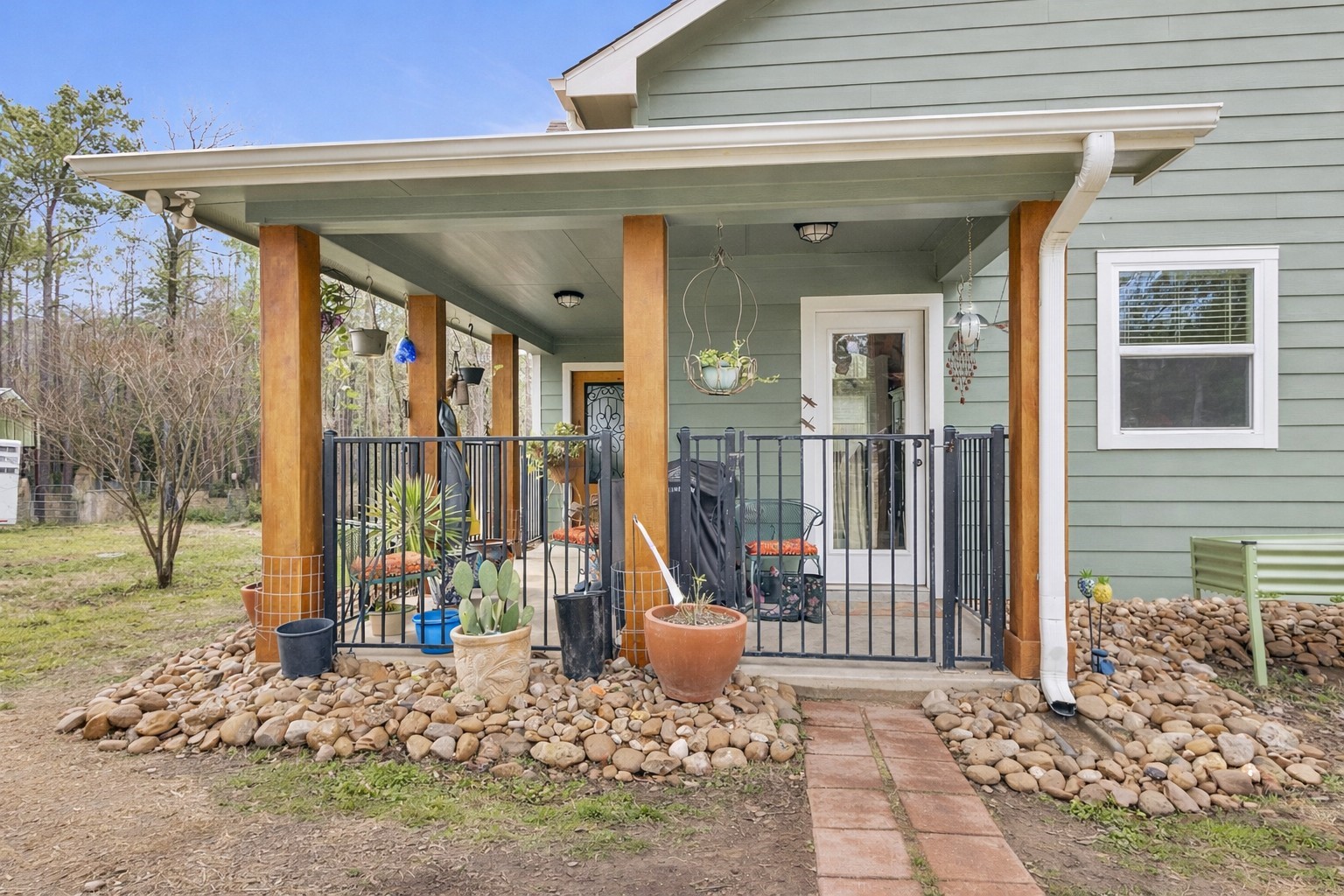 159 East Double Crk Road Willis, TX 77378 - Photo 5 of 40 Digitally edited to show spring-like landscaping.