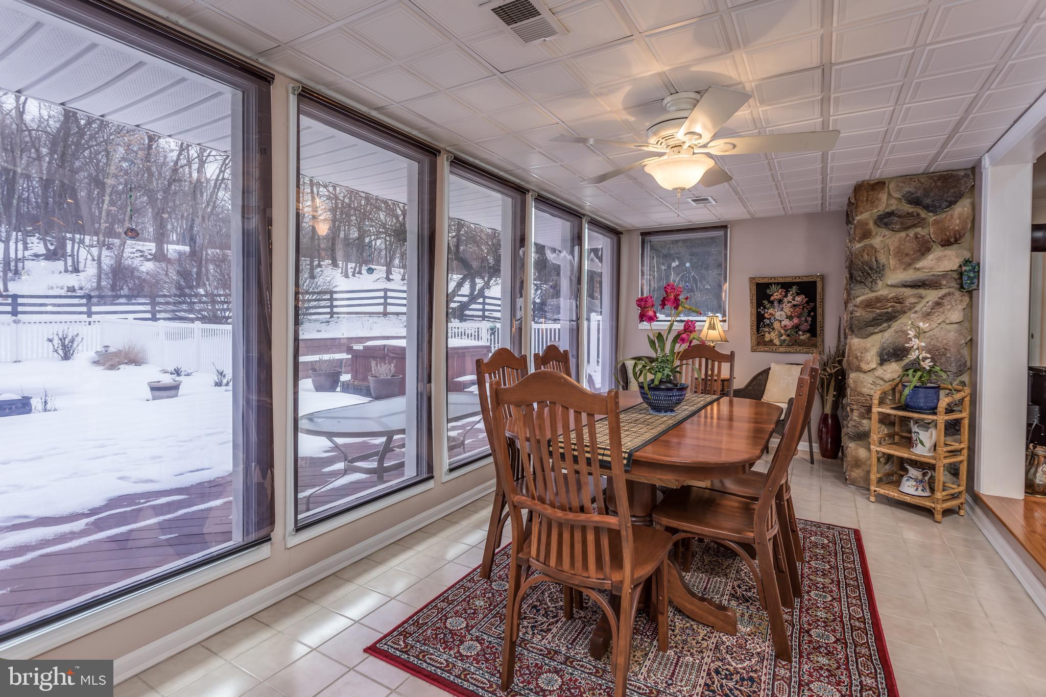 360 Glendobbin Road Winchester, VA 22603 - Photo 17 of 77 Dining room with wall of windows; view to pool