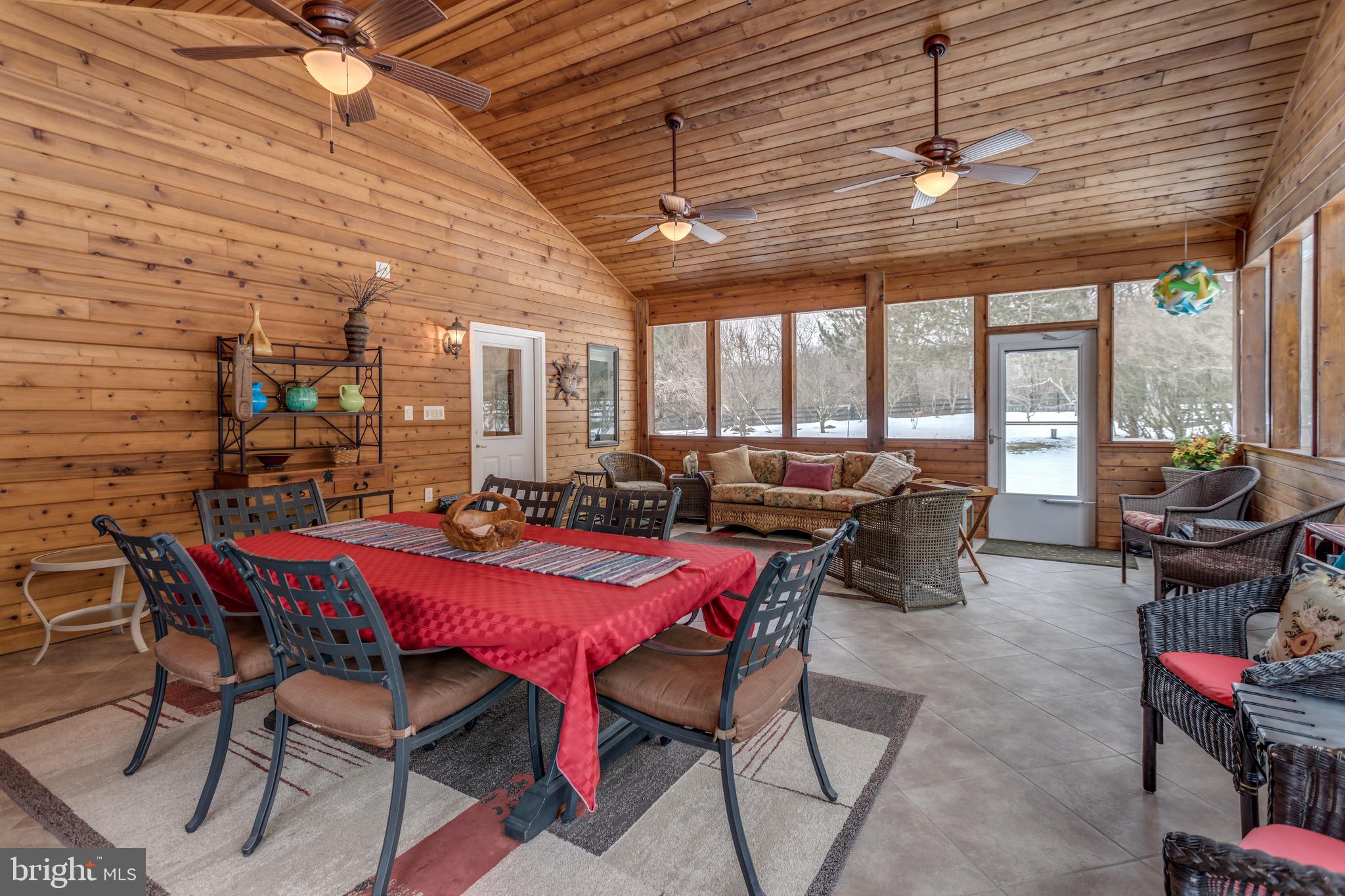 360 Glendobbin Road Winchester, VA 22603 - Photo 50 of 77 3-seasons room flows to 1200-sq-ft Trex deck