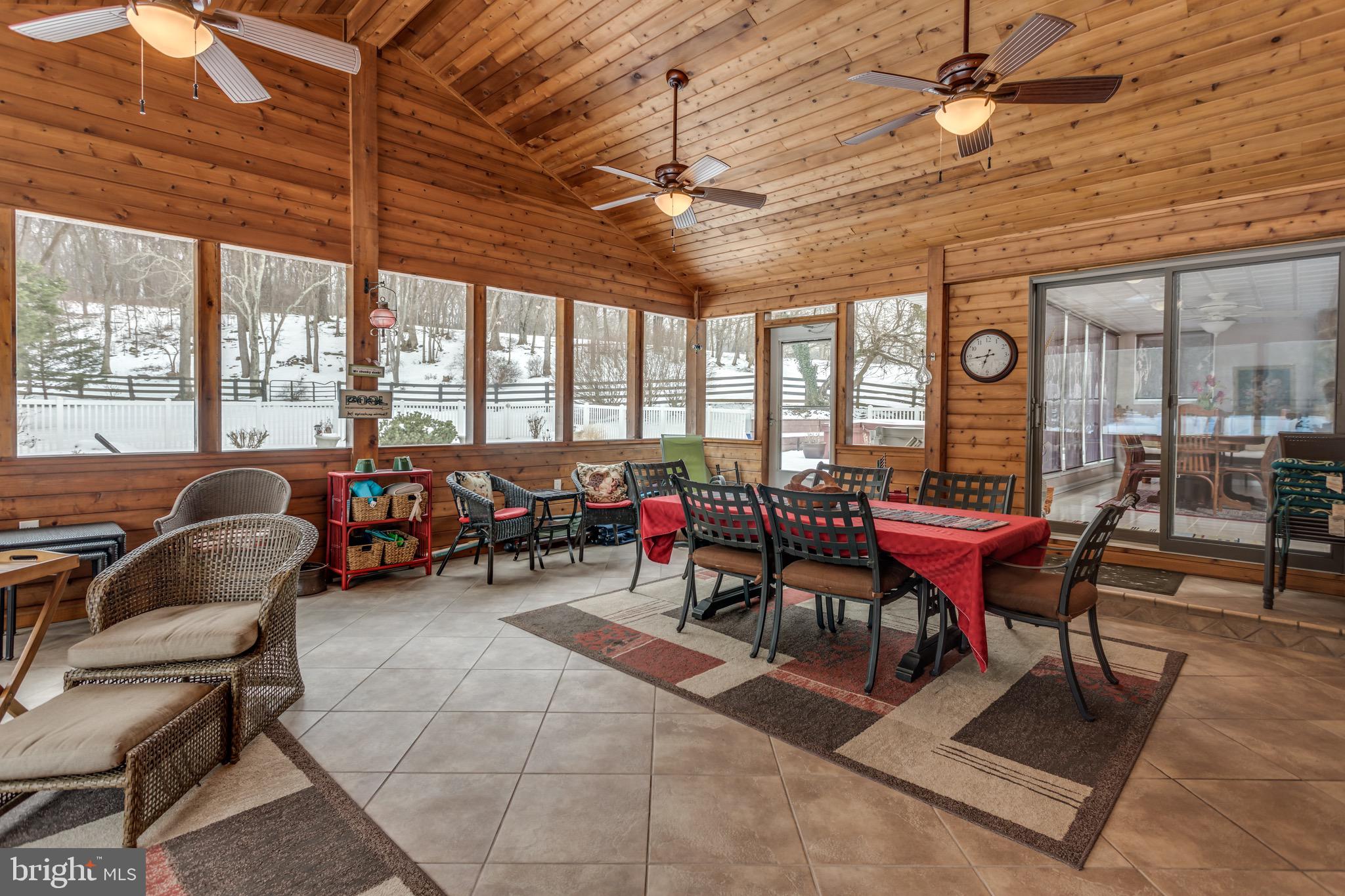 360 Glendobbin Road Winchester, VA 22603 - Photo 53 of 77 500+ sq-ft 3-season screened room adjacent to pool