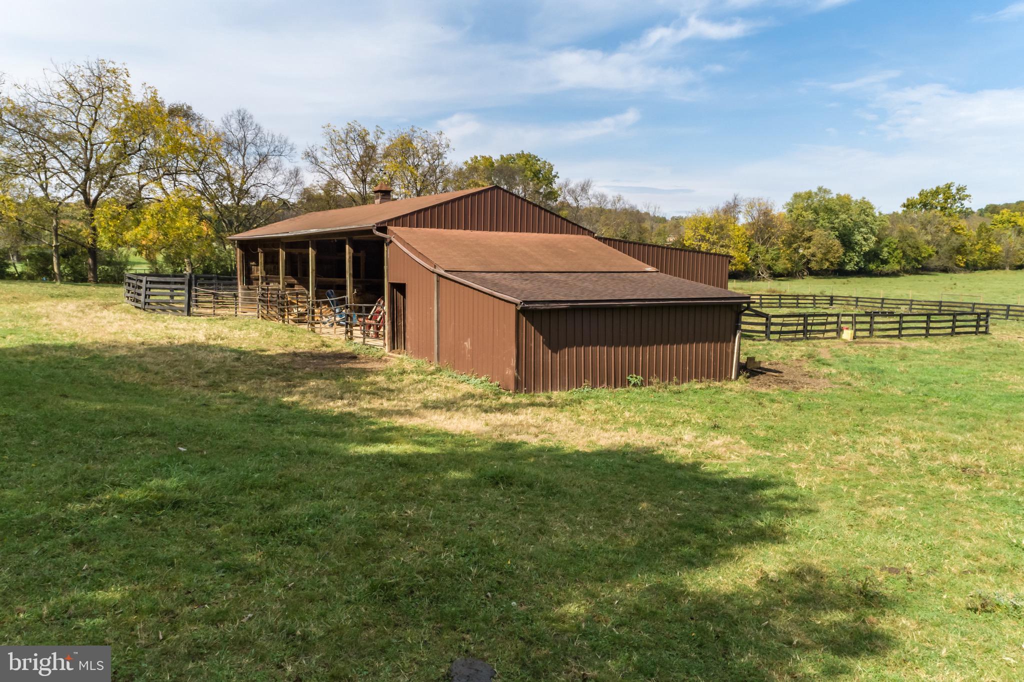 360 Glendobbin Road Winchester, VA 22603 - Photo 68 of 77 Large barn with stalls, run-ins, and hay storage