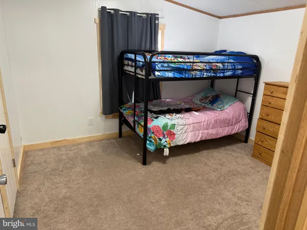 a bedroom with a bed and a baby