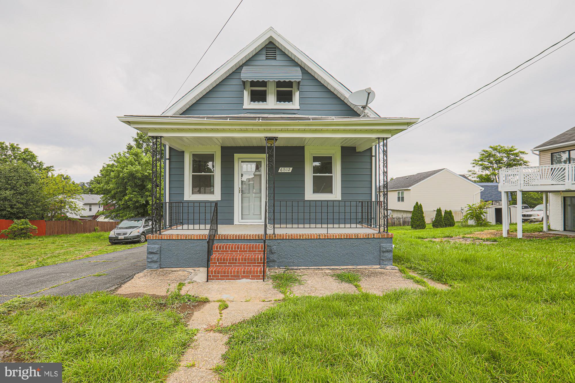 6512 Golden Ring Road Rosedale, MD 21237 - Photo 1 of 50 a front view of a house with a yard
