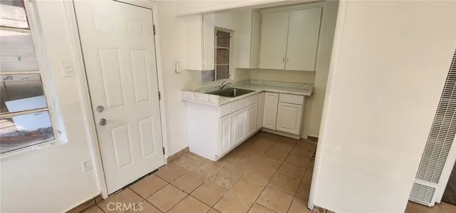 a bathroom with a sink a mirror and a shower