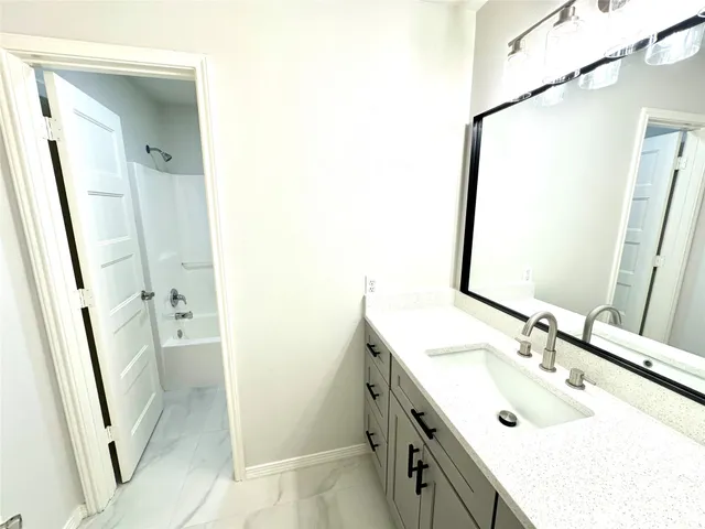 a view of a living room with a wooden floor