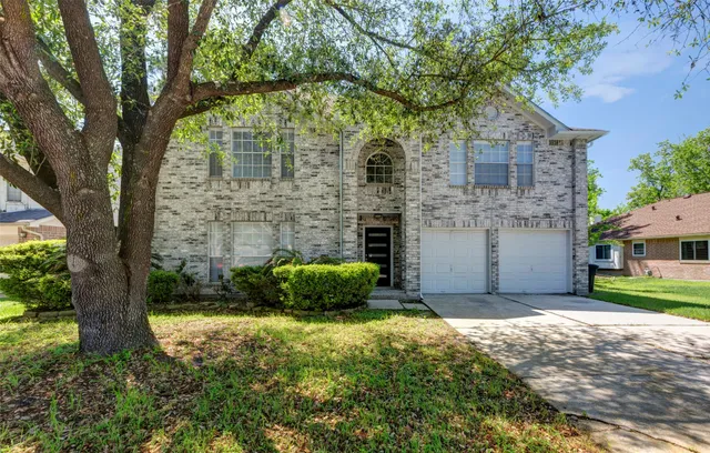 a view of a house with a garden