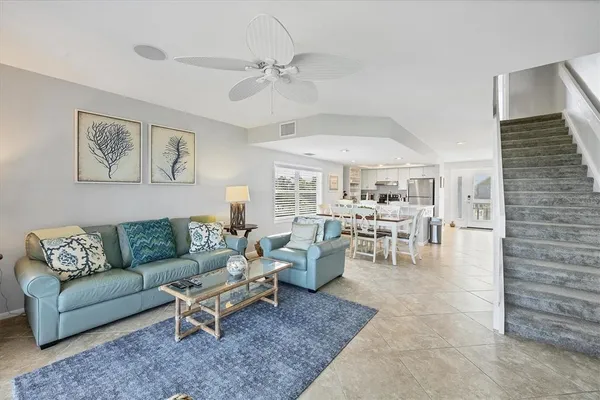 a living room with furniture and white walls