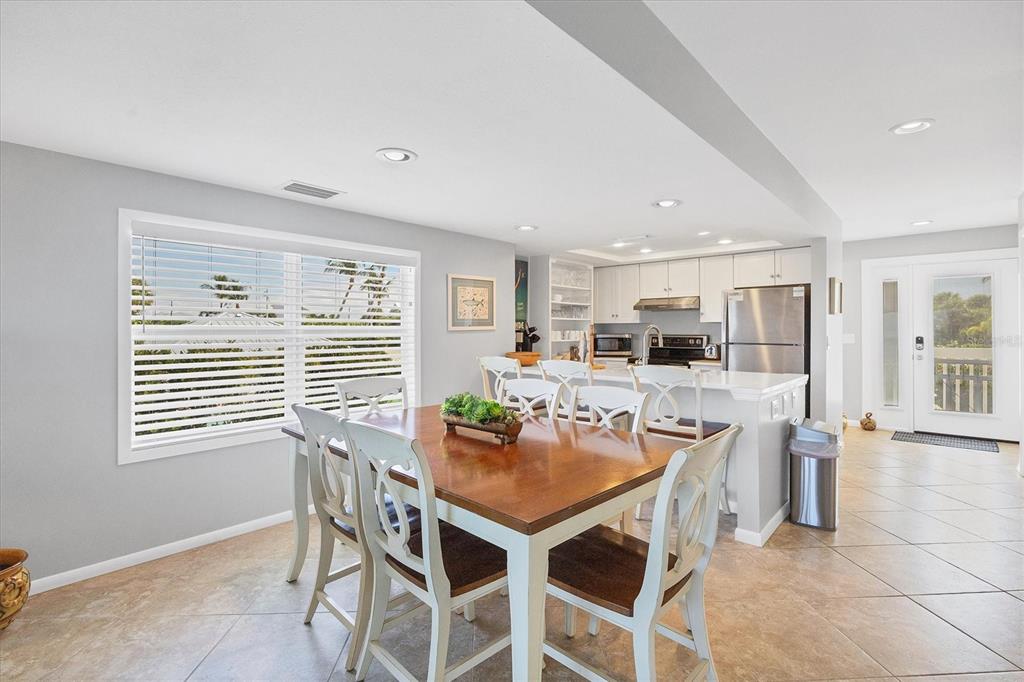 420 Gulf Boulevard, Unit 13 Boca Grande, FL 33921 - Photo 20 of 36 a dining room with furniture and window