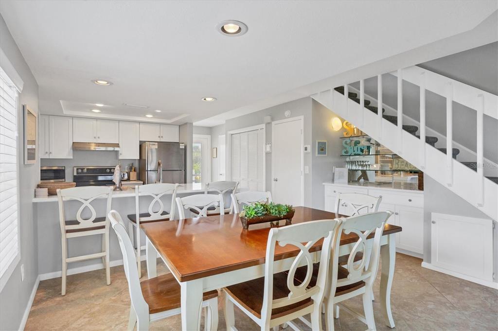 420 Gulf Boulevard, Unit 13 Boca Grande, FL 33921 - Photo 21 of 36 a view of a dining room with furniture
