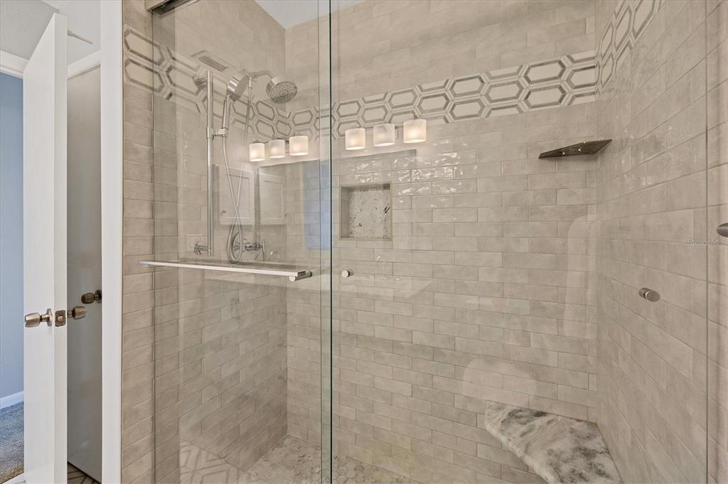 420 Gulf Boulevard, Unit 13 Boca Grande, FL 33921 - Photo 26 of 36 a bathroom with a shower