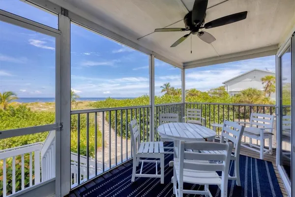 a view of a balcony with chairs