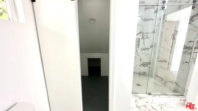a picture of a bathroom with a shower
