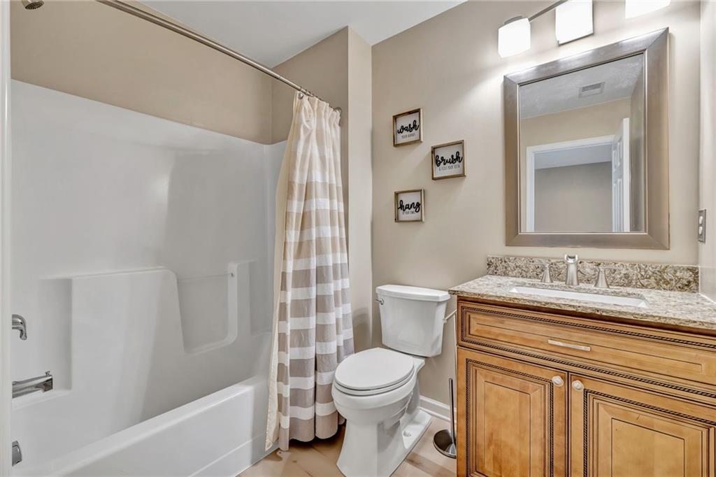 204 Hounslow Road Cranberry Township, PA 16066 - Photo 18 of 24 a bathroom with a sink a toilet and shower curtain