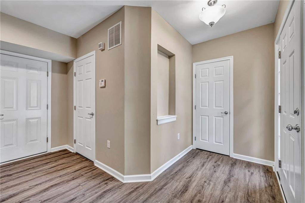 204 Hounslow Road Cranberry Township, PA 16066 - Photo 4 of 24 wooden floor in an empty room with a window