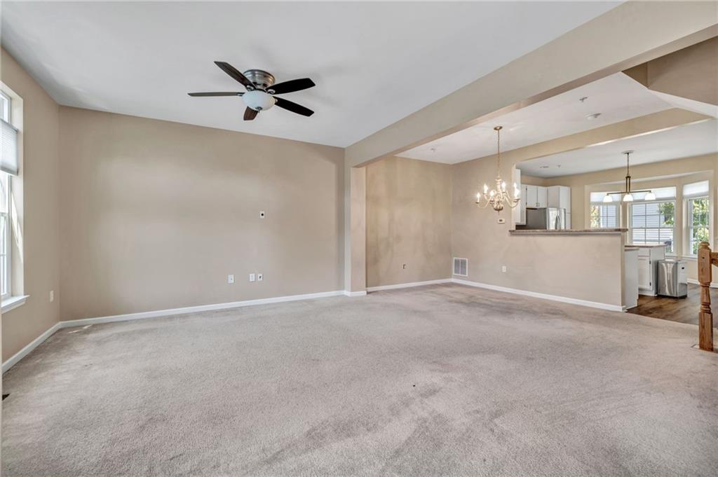 204 Hounslow Road Cranberry Township, PA 16066 - Photo 6 of 24 a view of a livingroom with a ceiling fan and window